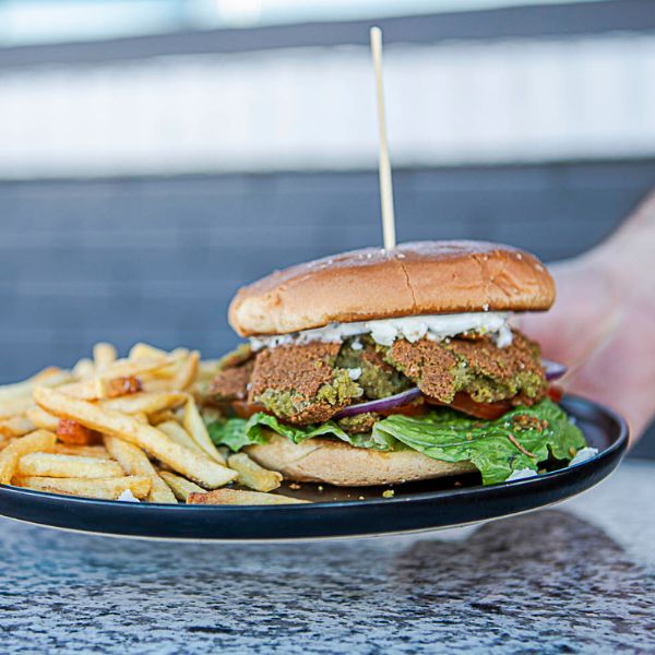 Falafel Smashburger with Fries - A delicious falafel smashburger served with crispy fries, perfect for vegetarians and Mediterranean food lovers in Port St Lucie Tradition and Fort Pierce at Swift Grill