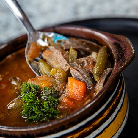 a spoon in a bowl of soup