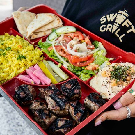 Steak Souvlaki served with rice, PITA, garlic sauce, salad, hummus, pickles & Turnips